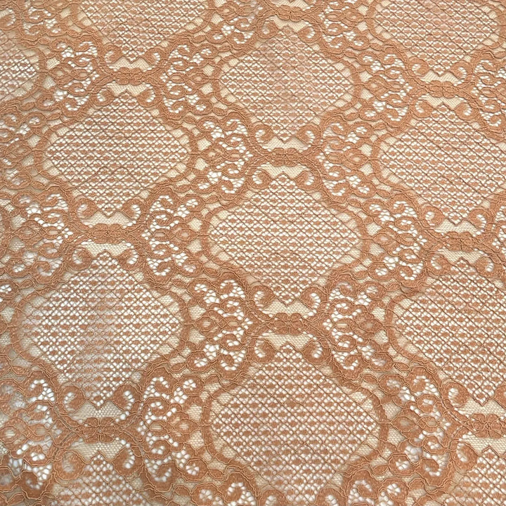 Nude lace with a repeating ornamental diamond motif