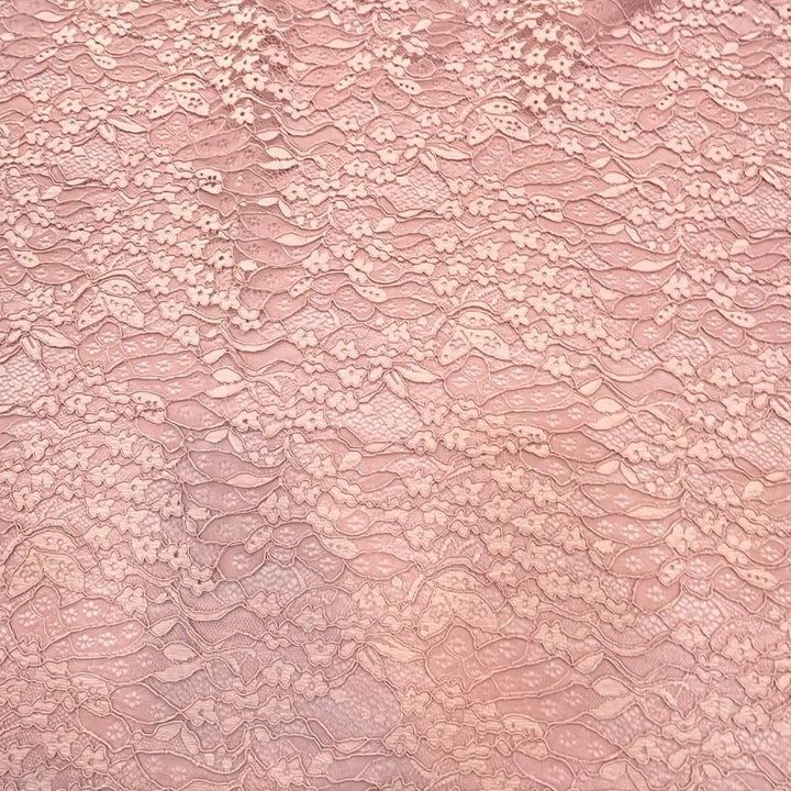 Blush pink floral corded lace with a dense all-over flower and leaf pattern
