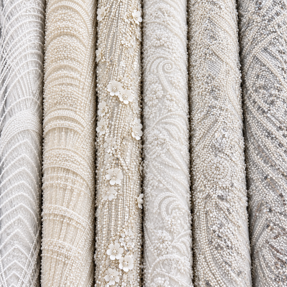 White and ivory bridal tulle rolls with pearl, floral and sequin details