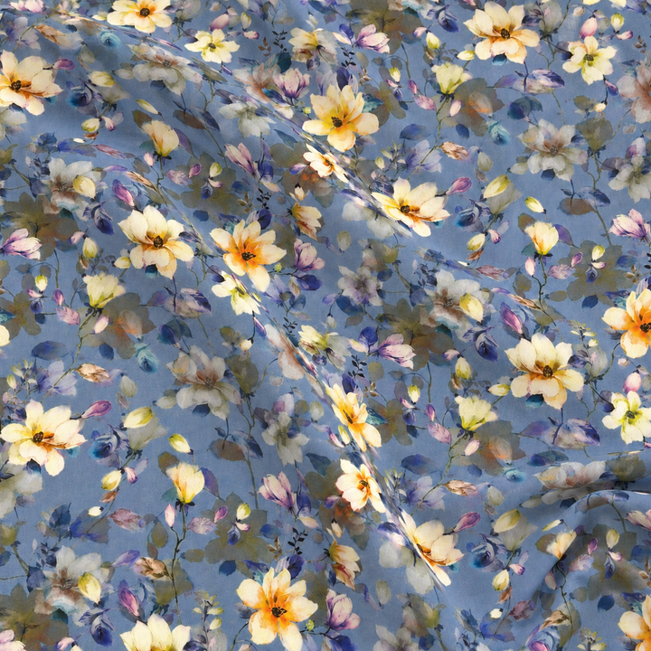 Daisy Meadow Cotton Print, Cornflower Blue, styled with natural fabric creases