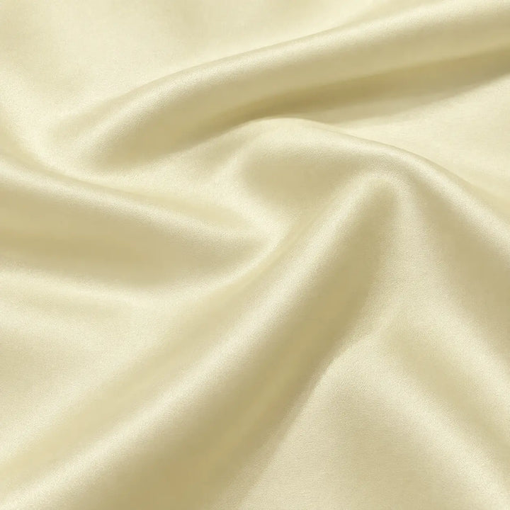Butter yellow Satin Premium fabric arranged in soft flowing folds