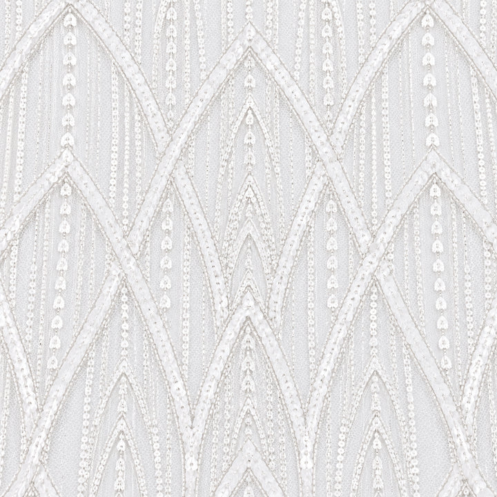 Close-up of white bridal tulle embroidered with repeating Art Deco arches and tonal sequin lines