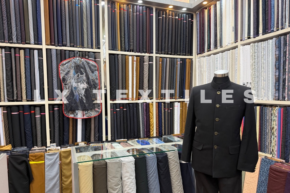 Tailoring fabrics and a formal suit display inside an LX Textiles retail store